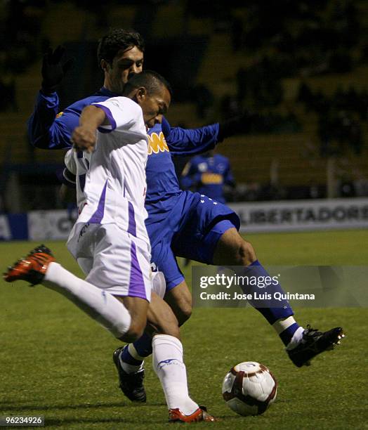 Edemir Rodriguez of Bolivia's Potosi vies for the ball with Brazil's Cruzeiro as part of Santander Libertadores Cup 2010 at Victor Agustin Stadium on...