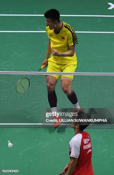 Chen Long of China reacts after winning a point against of Anthony Sinisuka Ginting of Indonesia during their men's singles semifinals match at the...