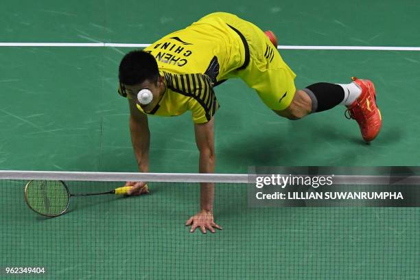 Chen Long of China hits a return against of Anthony Sinisuka Ginting of Indonesia during their men's singles semifinals match at the Thomas and Uber...