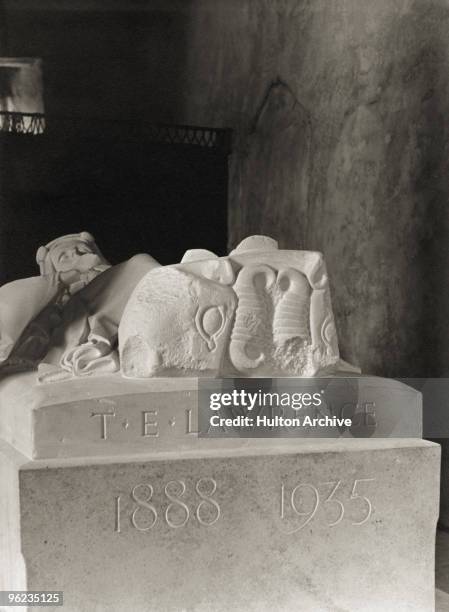 The carved inscription on a stone effigy, by war artist Eric Kennington, of British soldier, adventurer and author T. E. Lawrence in the church of St...