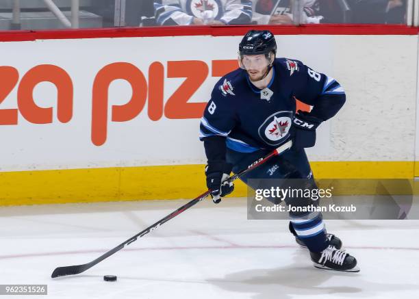 Jacob Trouba of the Winnipeg Jets plays the puck down the ice during second period action against the Vegas Golden Knights in Game Five of the...