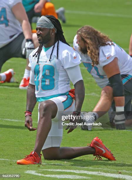 Marqueis Gray of the Miami Dolphins stretches during the teams training camp on May 23, 2018 at the Miami Dolphins training facility in Davie,...