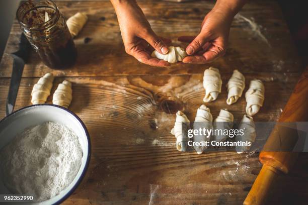 housewife roll pieces of dough with plum jam - croissant jam stock pictures, royalty-free photos & images