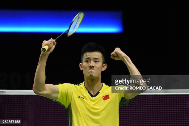 Chen Long of China celebrates after defeating Anthony Sinisuka Ginting of Indonesia during their men's semifinals match at the Thomas and Uber Cup...