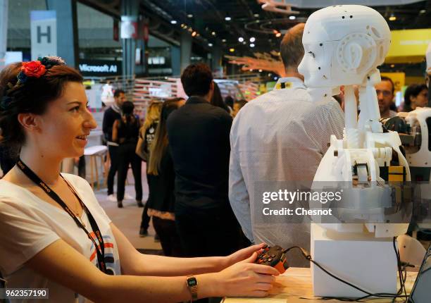 Visitor tests a humanoid robot made from a 3D printer at the InMoov corner during the Viva Technology show at Parc des Expositions Porte de...
