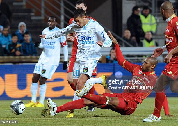 Marseille's Hatem Ben Arfa vies with Le Mans's Herold Goulon during the French L1 football match Marseille vs. Le Mans, on January 20, 2010 at the...