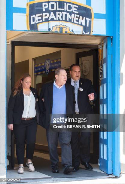 Harvey Weinstein leaves the New York City Police Department's First Precinct on May 25, 2018 in New York. Weinstein was arrested and charged Friday...