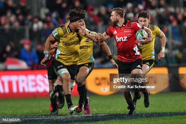 Braydon Ennor of the Crusaders charges forward during the round 15 Super Rugby match between the Crusaders and the Hurricanes at AMI Stadium on May...