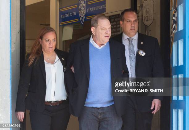 Harvey Weinstein leaves the New York City Police Department's First Precinct on May 25, 2018 in New York. Weinstein was arrested and charged Friday...