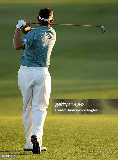 Lee Westwood of England hits his second shot on the 18th hole during the first round of the Commercialbank Qatar Masters at Doha Golf Club on January...