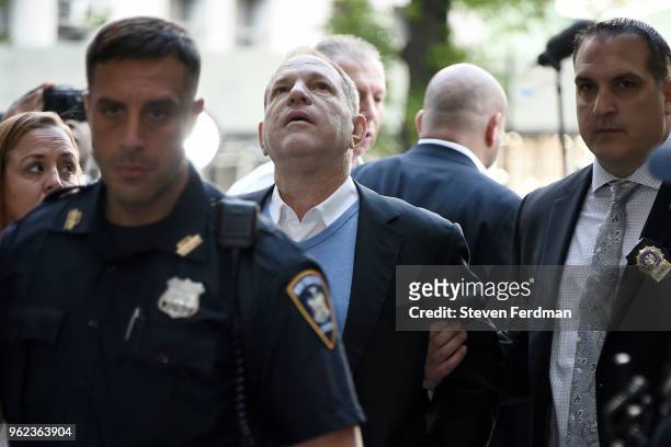 Harvey Weinstein arrives for arraignment at Manhattan Criminal Courthouse in handcuffs after being arrested and processed on charges of rape,...