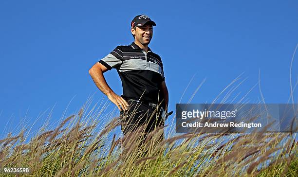 Oliver Wilson of England smiles on the 16th hole during the first round of the Commercialbank Qatar Masters at Doha Golf Club on January 28, 2010 in...