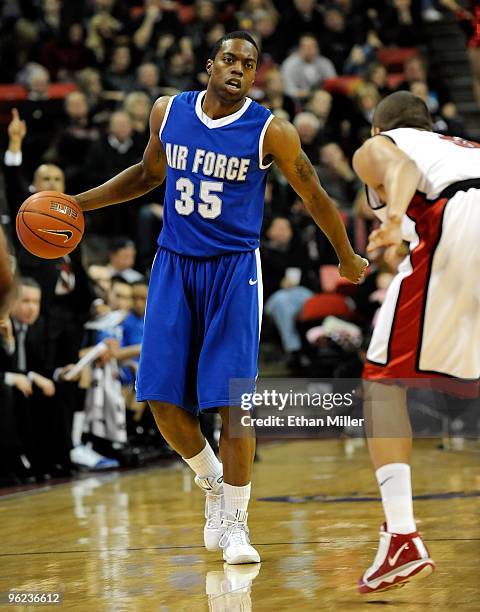 Evan Washington of the Air Force Falcons brings the ball up the court against the UNLV Rebels during the game at the Thomas & Mack Center on January...