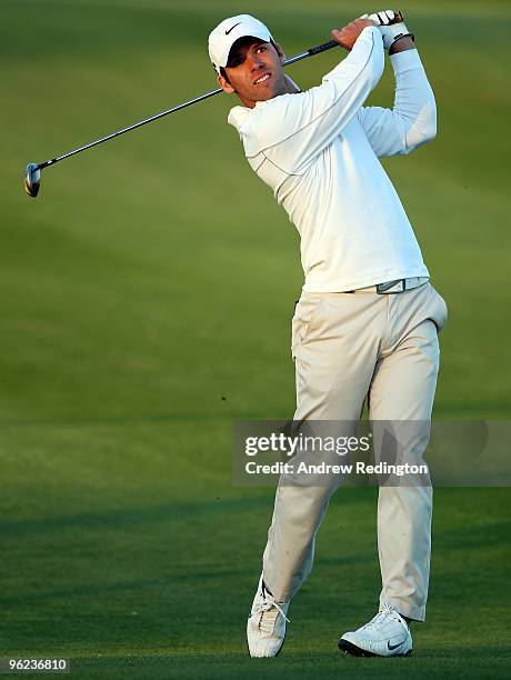 Paul Casey of England hits his second shot on the 18th hole during the first round of the Commercialbank Qatar Masters at Doha Golf Club on January...