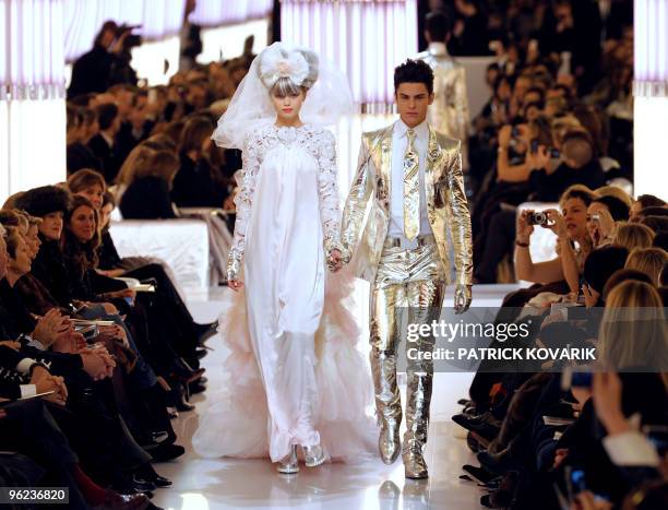 Models present creations by German designer Karl Lagerfeld for Chanel during the spring-summer 2010 haute couture collection show on January 26, 2010...