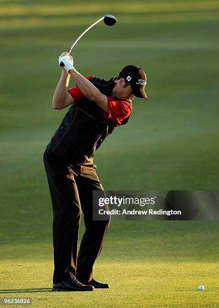 Ross Fisher of England hits his second shot on the 18th hole during the first round of the Commercialbank Qatar Masters at Doha Golf Club on January...