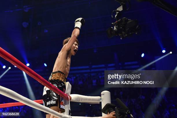 Japan's Naoya Inoue celebrates his win over Great Britain's Jamie McDonnell during their WBA world bantamweight title boxing bout in Tokyo on May 25,...