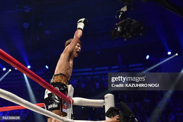 Japan's Naoya Inoue celebrates his win over Great Britain's Jamie McDonnell during their WBA world bantamweight title boxing bout in Tokyo on May 25,...