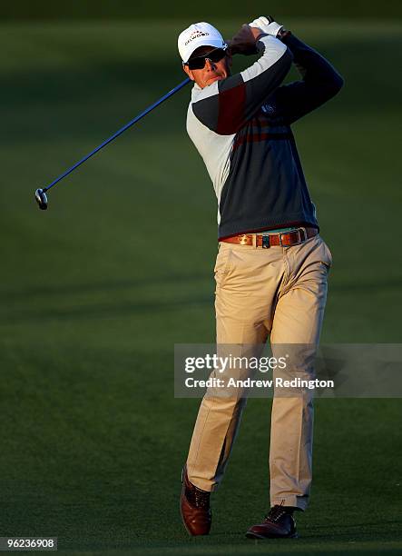 Henrik Stenson of Sweden hits his second shot on the 18th hole during the first round of the Commercialbank Qatar Masters at Doha Golf Club on...