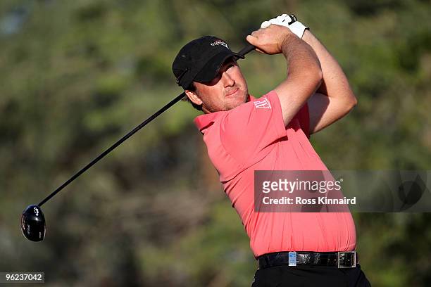 Graeme McDowell of Northern Ireland on the 18th tee during the first round of The Commercialbank Qatar Masters at The Doha Golf Club on January 28,...