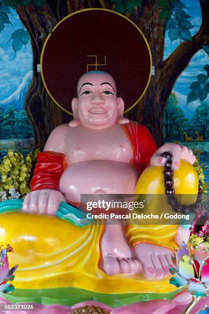 phap van buddhist temple. happy buddha statue for good luck and fortune. ho chi minh city. vietnam. - phap ho stock pictures, royalty-free photos & images