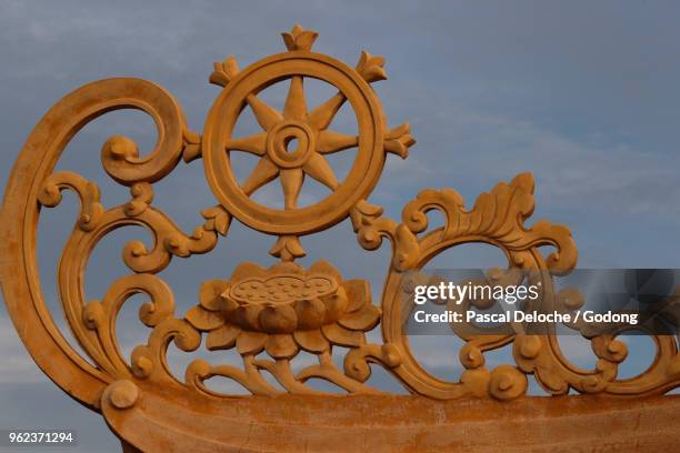 minh dang quang buddhist temple. dharmachakra, the buddhist eight-fold path illustrated in a wheel. ho chi minh city. vietnam. - dharmachakra stock pictures, royalty-free photos & images