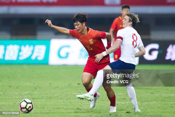 Conor Gallagher of England U19 National Team and Xu Lei of China U19 National Team compete for the ball during the 2018 Panda Cup International Youth...