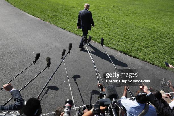 President Donald Trump walks toward the waiting Marine One after talking to members of the news media before departing the White House May 25, 2018...