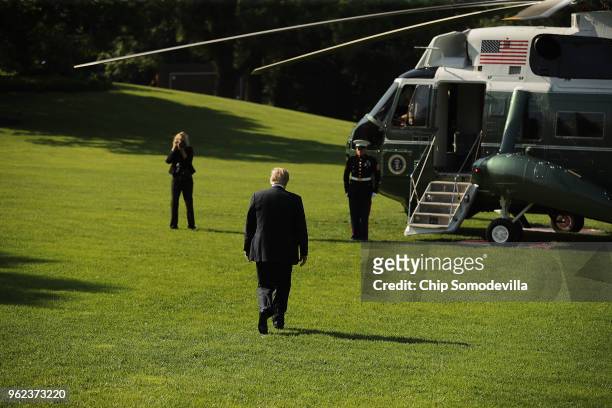 President Donald Trump walks across the South Lawn before boarding Marine One and departing the White House May 25, 2018 in Washington, DC. Trump is...