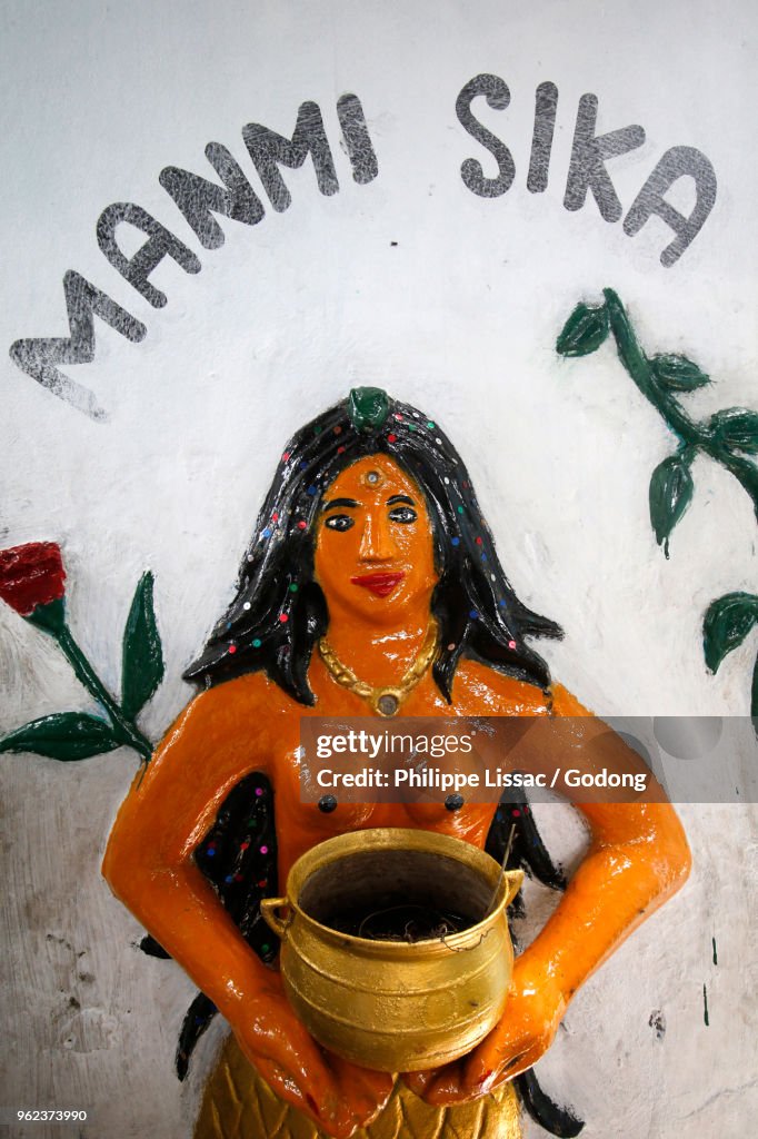 Voodoo shrine in Cotonou, Benin. Godess Manmi Sika.