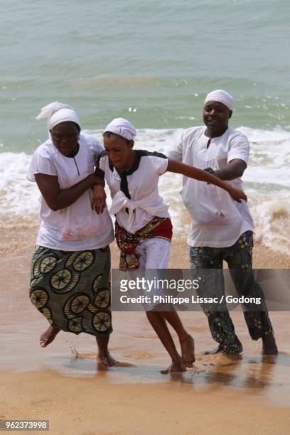 voodoo cult on a beach in cotonou, benin. tranced devotee. - animism stock pictures, royalty-free photos & images
