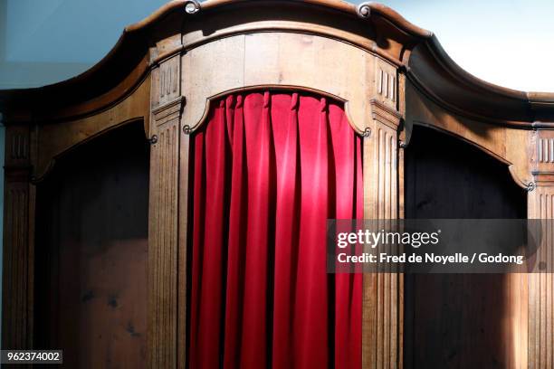 a confessional in which the priest in christian churches sits to hear the confessions of penitents. fribourg. switzerland. - katolicism bildbanksfoton och bilder