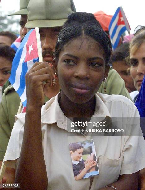 Cuban student participates in a political demonstration 10 June, 2000 in Palma Soriano, Santiago de Cuba province, demanding the return of Elian...