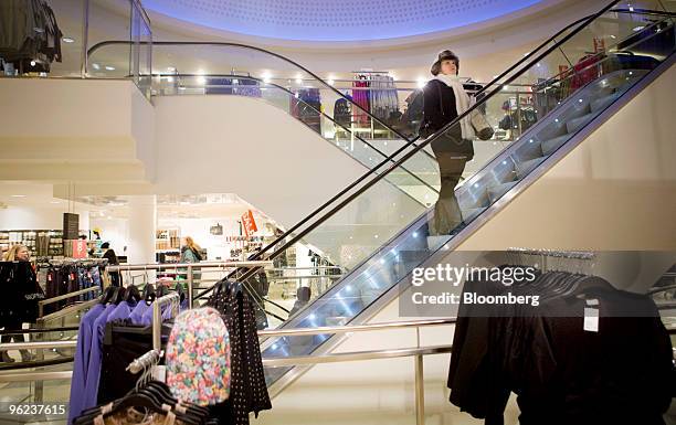 Customers browse inside a Hennes & Mauritz AB store in Stockholm, Sweden, on Thursday, Jan. 28, 2010. Hennes & Mauritz AB, Europe's second-largest...