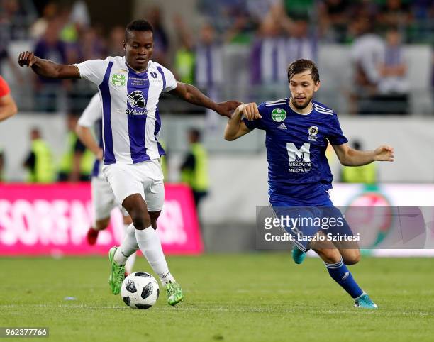 Vincent Onovo of Ujpest FC wins the ball from David Markvart of Puskas Akademia FC during the Hungarian Cup Final match between Puskas Akademia FC...