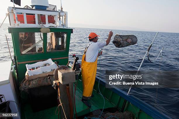 fisherman of sardinia - trawler net stock-fotos und bilder