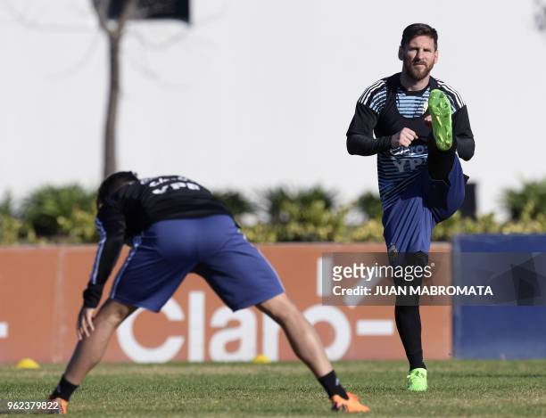 Argentina's national football team forward Lionel Messi , stretches during a training session in Ezeiza, Buenos Aires on May 25, 2018. - The...