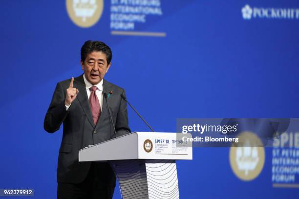 Shinzo Abe, Japan's prime minister, gestures as he speaks during the plenary session at the St. Petersburg International Economic Forum in St....