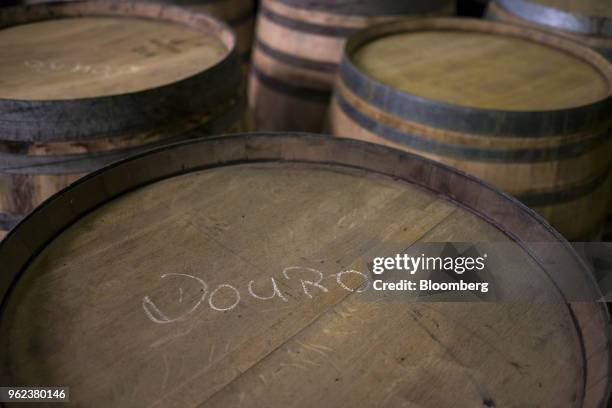 Wine barrels stand ahead of grape harvest season and port production at the Symington-Family Estates Vinhos Lda vineyard in the Douro Valley region...