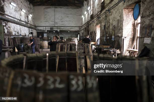 Coopers assemble wine barrels ahead of the grape harvest season and port production at the Symington-Family Estates Vinhos Lda vineyard in the Douro...