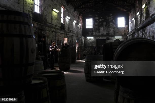 Coopers assemble wine barrels ahead of the grape harvest season and port production at the Symington-Family Estates Vinhos Lda vineyard in the Douro...