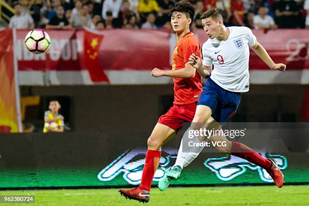 Stephen Walker of England U19 National Team and Wu Shaocong of China U19 National Team compete for the ball during the 2018 Panda Cup International...