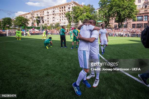 Roberto Carlos of Real Madrid CF hugs Michel Salgado of Real Madrid CF in the Ultimate Champions Tournament prior to the UEFA Champions League final...