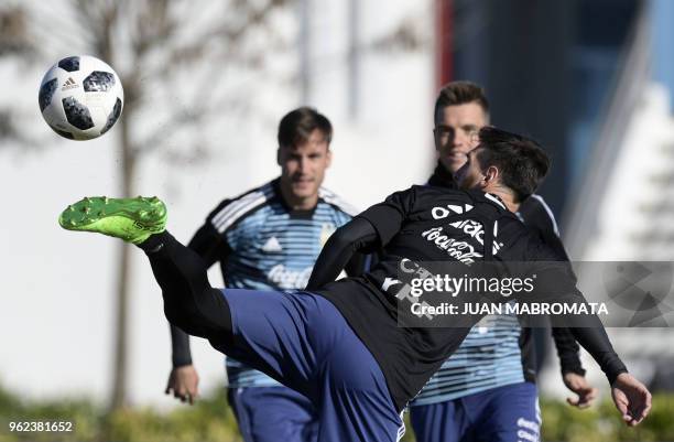 Argentina's national football team forward Lionel Messi, controls the ball during a training session in Ezeiza, Buenos Aires on May 25, 2018. - The...