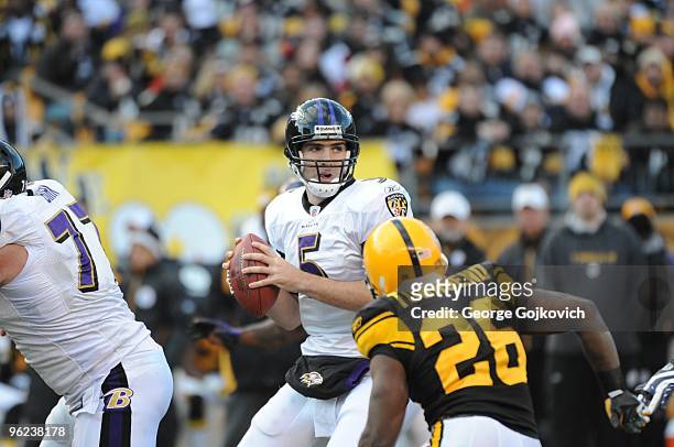 Quarterback Joe Flacco of the Baltimore Ravens looks to pass as he is pressured by defensive back Deshea Townsend of the Pittsburgh Steelers at Heinz...