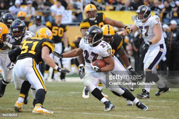 Running back Ray Rice of the Baltimore Ravens runs against linebacker James Farrior of the Pittsburgh Steelers during a game at Heinz Field on...