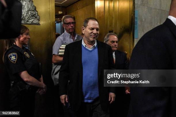 Harvey Weinstein exits the court room with his lawyer Benjamin Brafman after his arraignment at Manhattan Criminal Court on May 25, 2018 in New York...