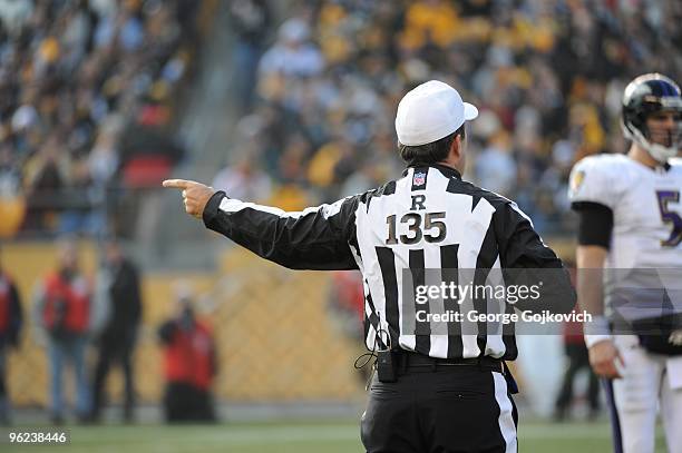 National Football League referee Pete Morelli signals during a game between the Baltimore Ravens and the Pittsburgh Steelers at Heinz Field on...