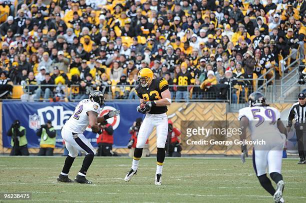 Tight end Heath Miller of the Pittsburgh Steelers catches a pass against linebacker Ray Lewis of the Baltimore Ravens at Heinz Field on December 27,...
