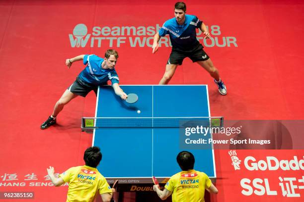 Patrick Franziska of Germany and Jonathan Groth of Denmark compete against Masataka Morizono and Yuya Oshima of Japan during men's doubles -...